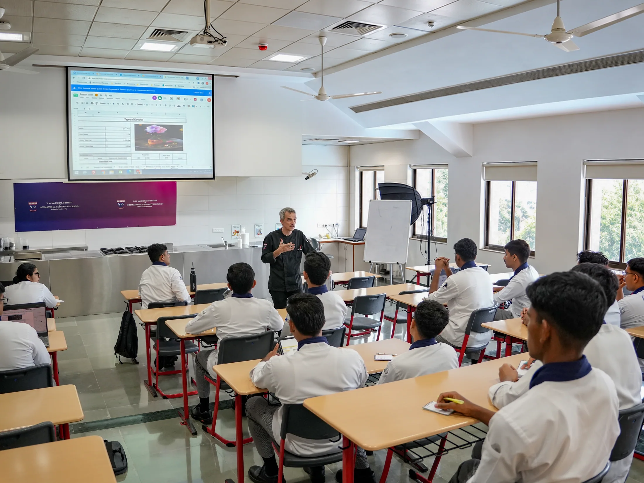 Chef leading a classroom session for hospitality students